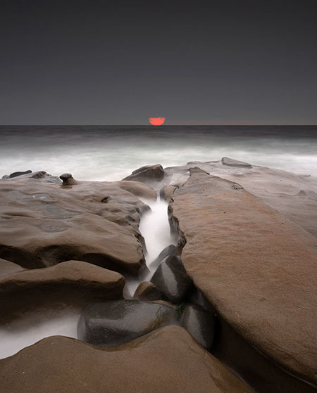 Color photograph of stones in Lake Henshaw, San Diego