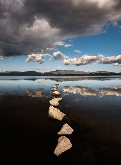 Color photograph of stones in Lake Henshaw, San Diego