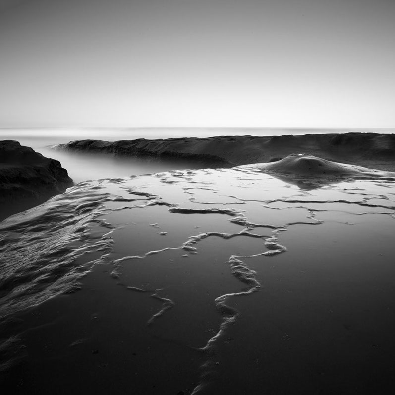 Black and white photo of the shoreline at Hospitals Reef, San Diego