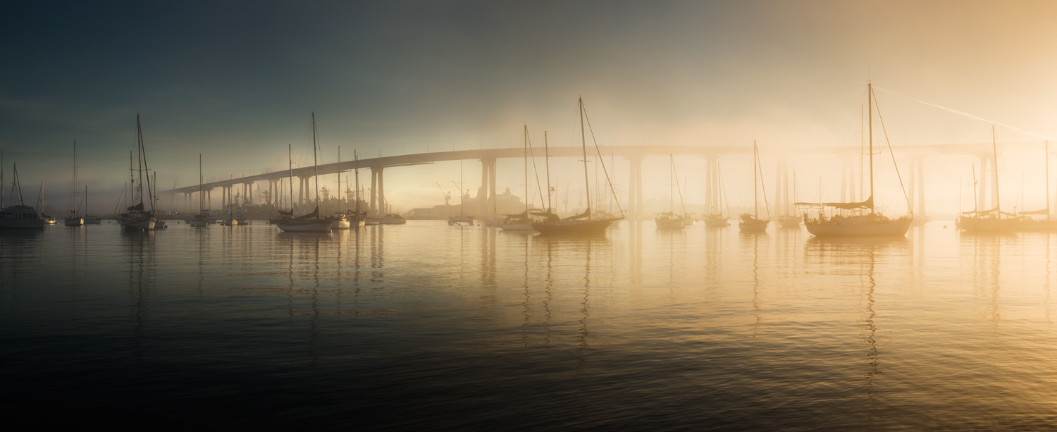 Color photo of boats and the Coronado Bridge in San Diego Bay